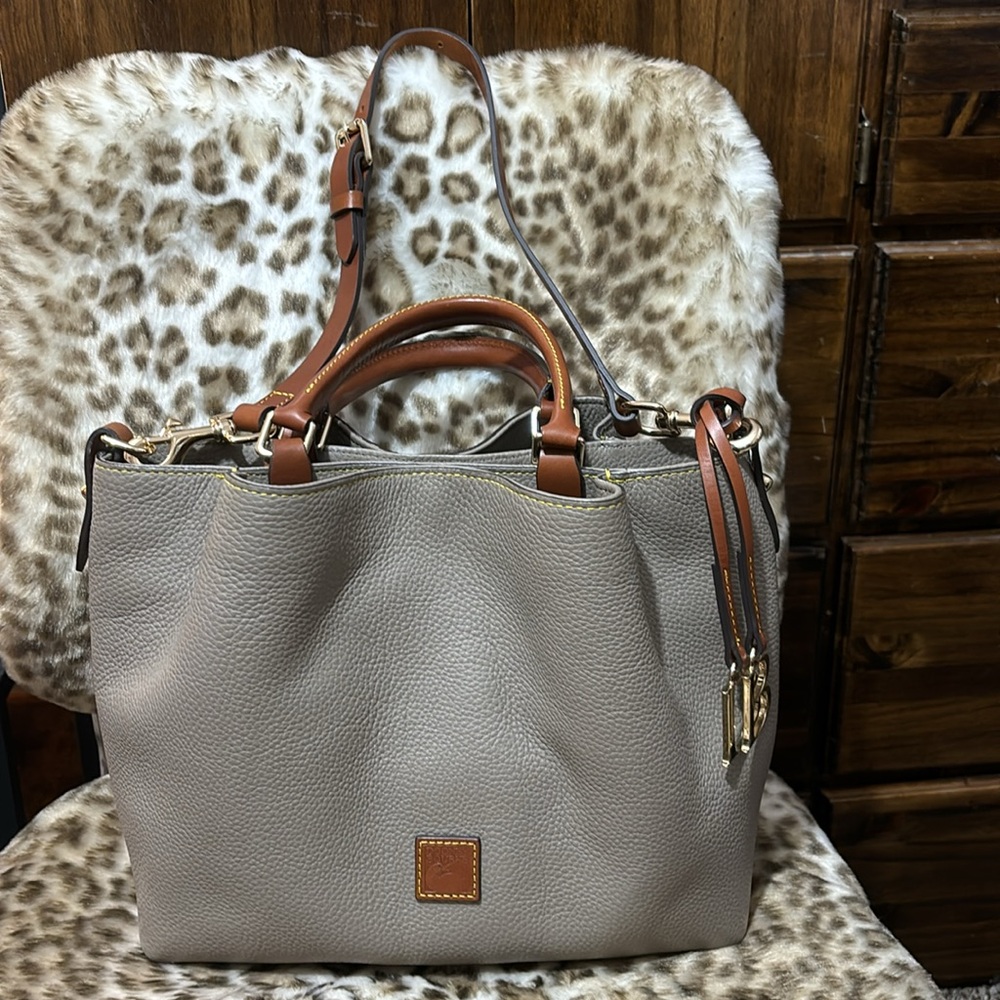 Dooney and Burke Barlow Bag. Taupe with brown trim. Very good condition.